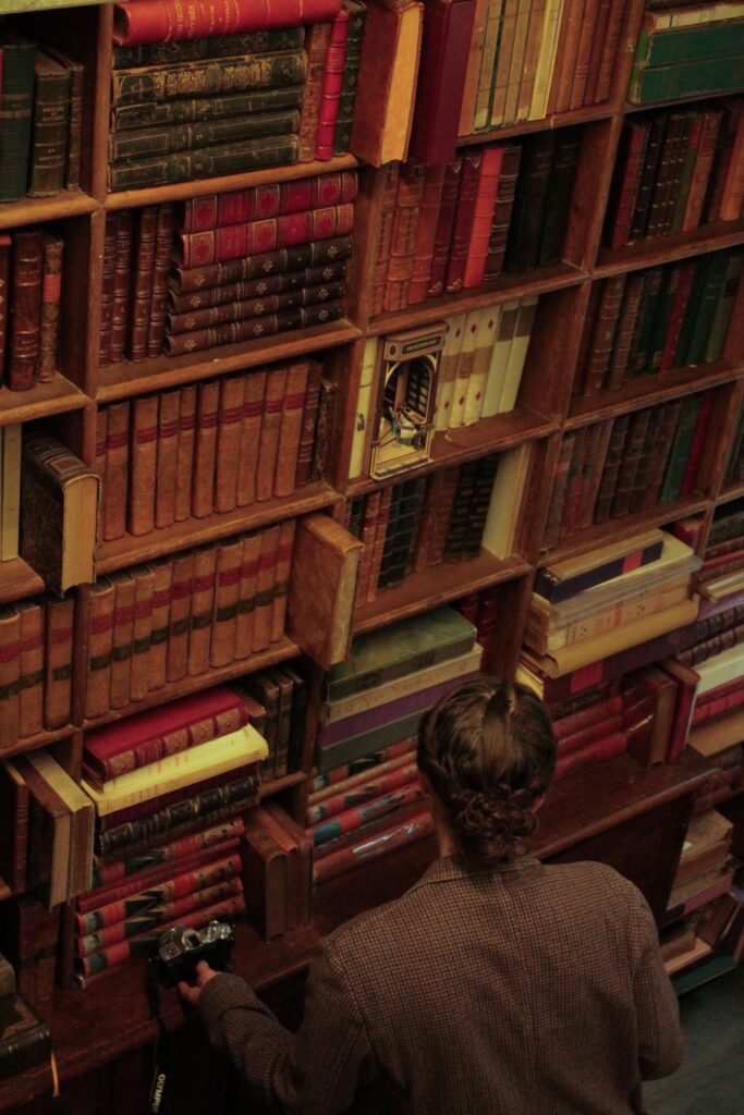 Interior of L'Escurial independent bookstore with vintage books collection on rue Alphonse Karr, Nice