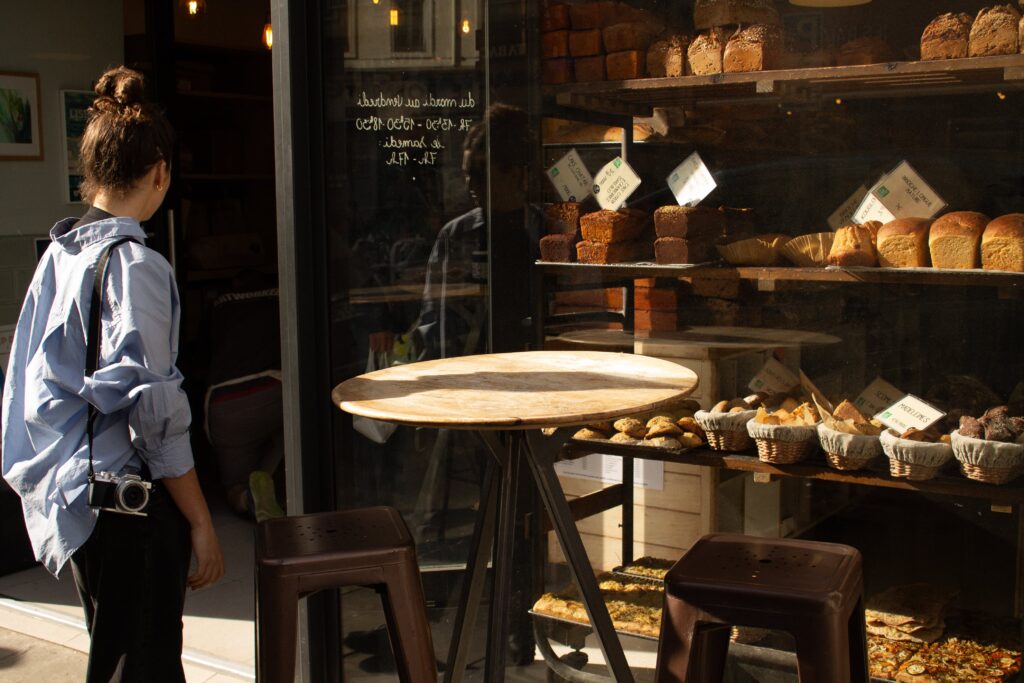 Queue of customers waiting for fresh bread at Mama Baker, Nice.