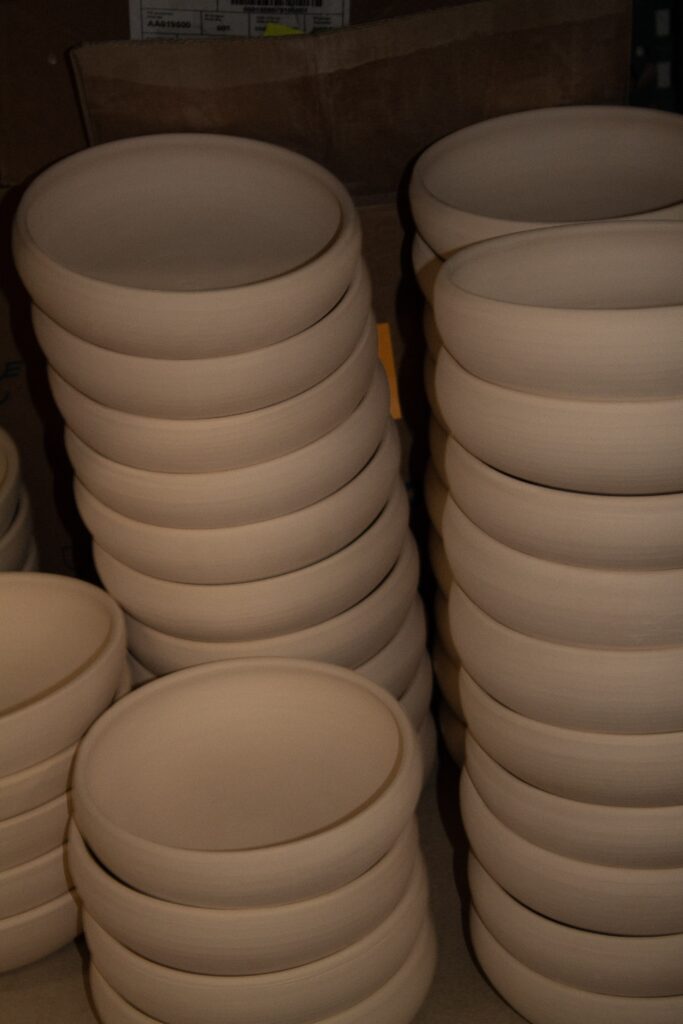 Handmade ceramic pieces with rounded shapes by Tino Aiello