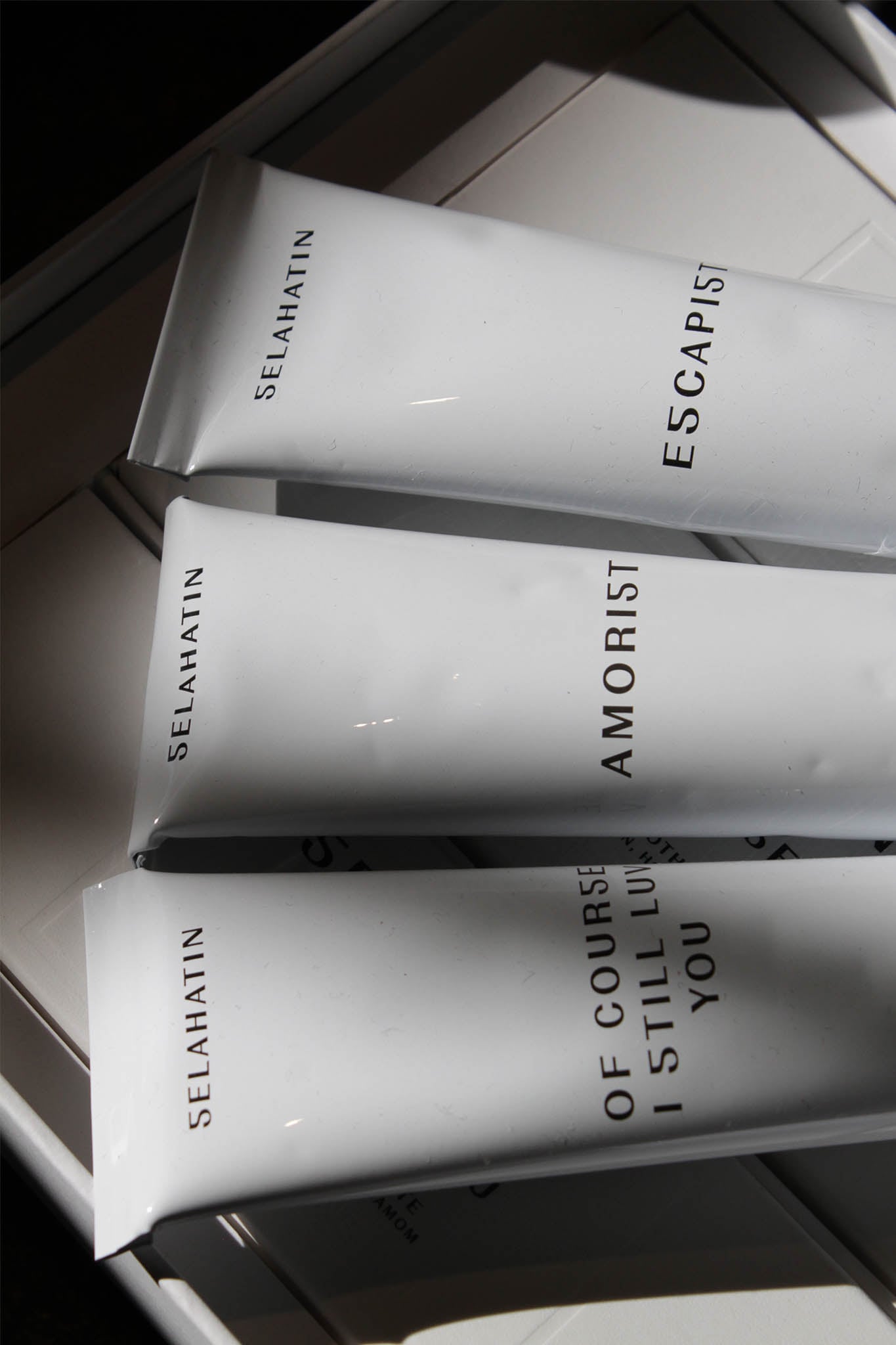 Minimalist bathroom styling direction emphasizing clean lines and sophisticated product placement.
