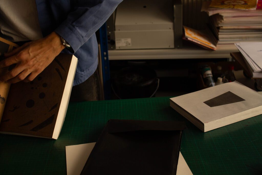 "Minimal screen time philosophy focusing on hands-on paper-based work and machines