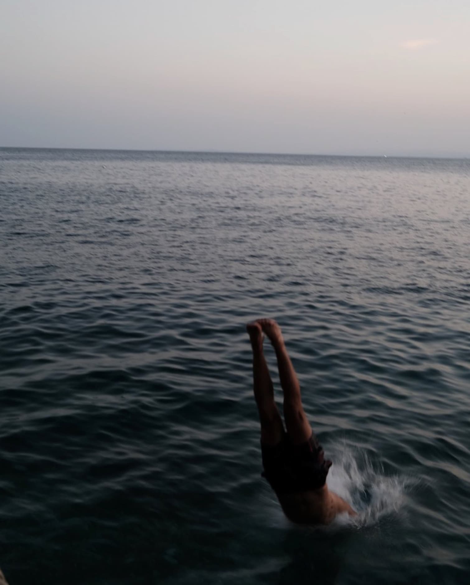 Yvan Canal Street 55 — person diving into the sea, spontaneous moment, Nice