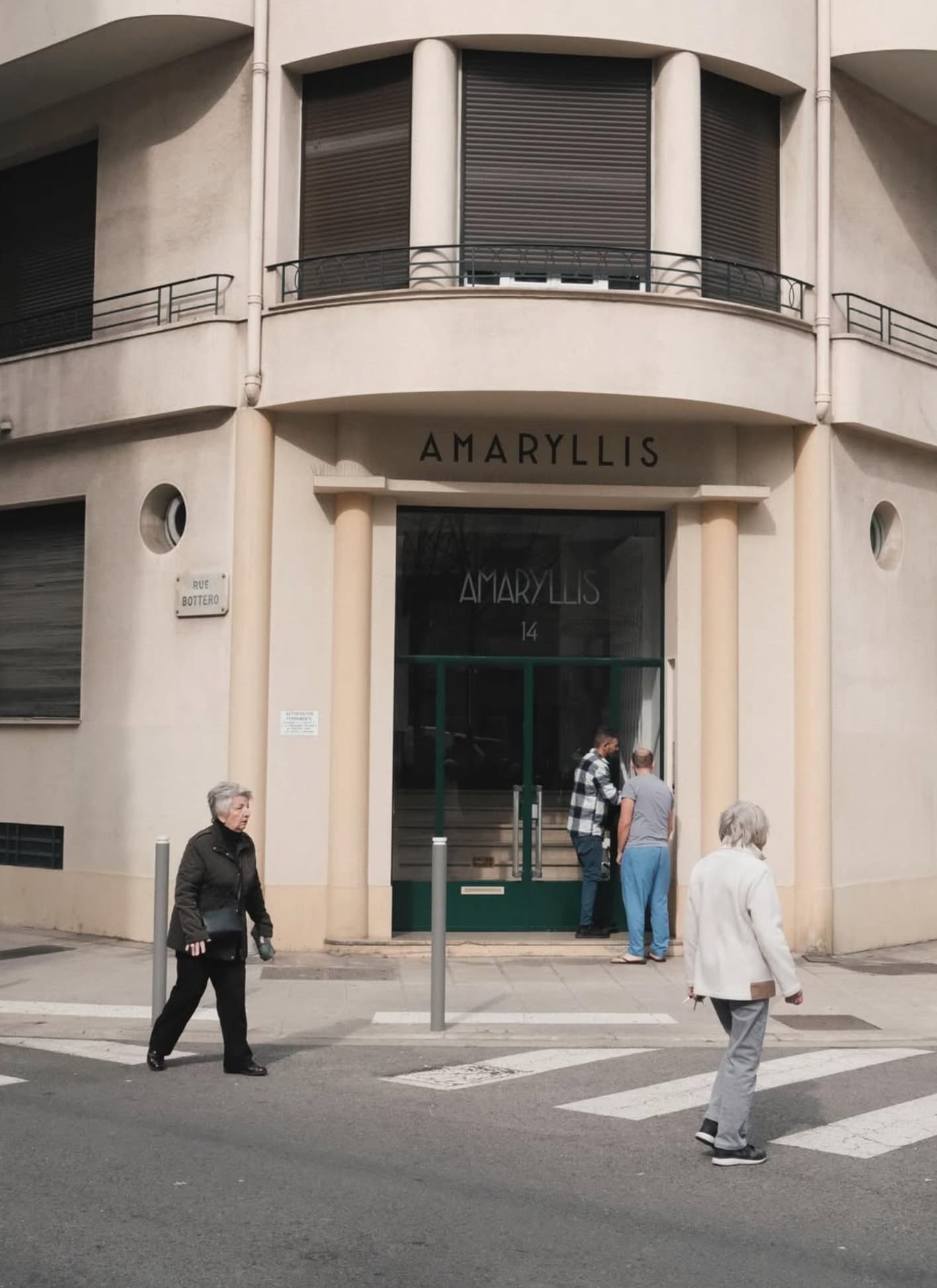 Yvan Canal Street 55 — people crossing a street corner in Nice, everyday moment