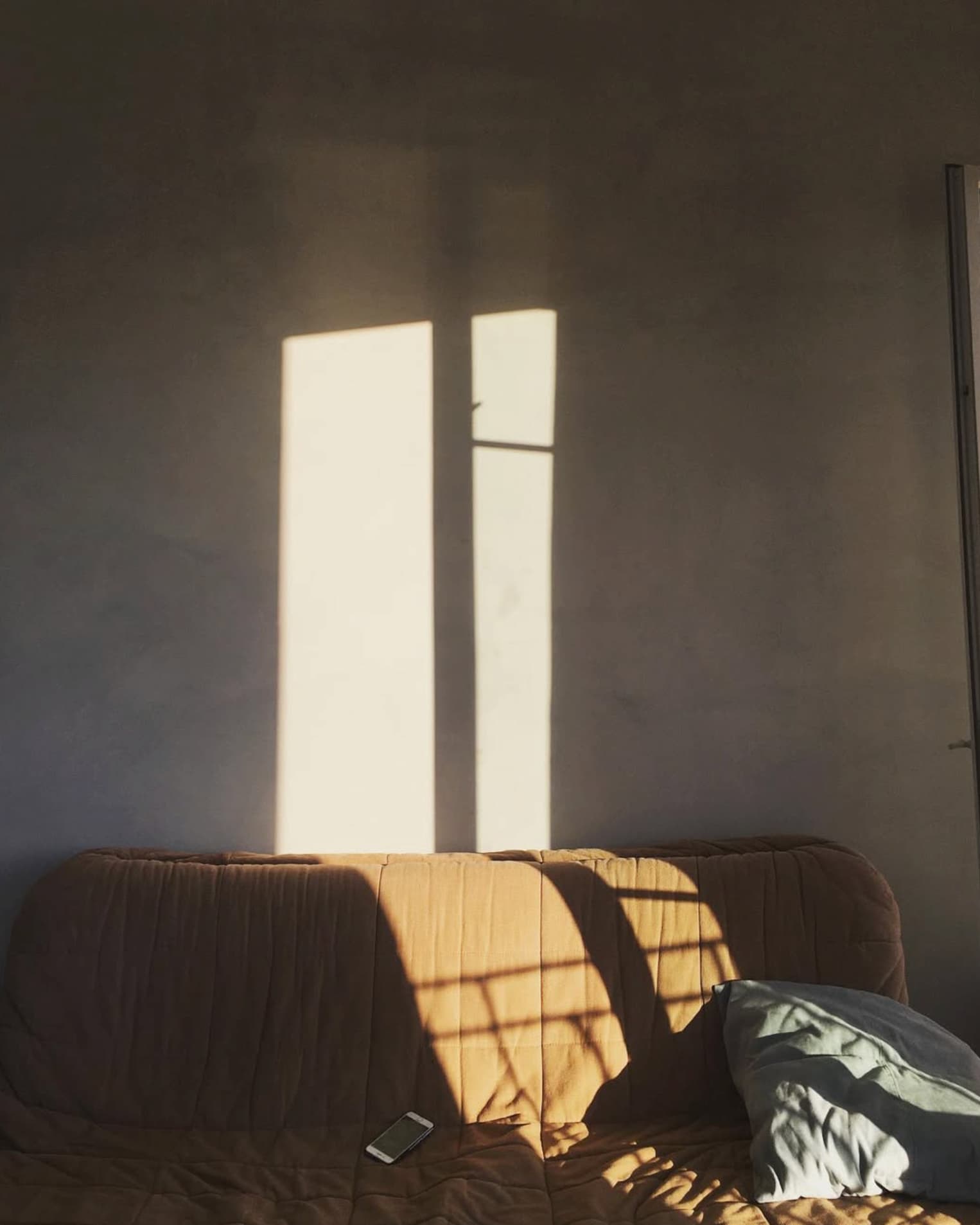 Yvan Canal Street 55 — morning light entering a bedroom, interior detail