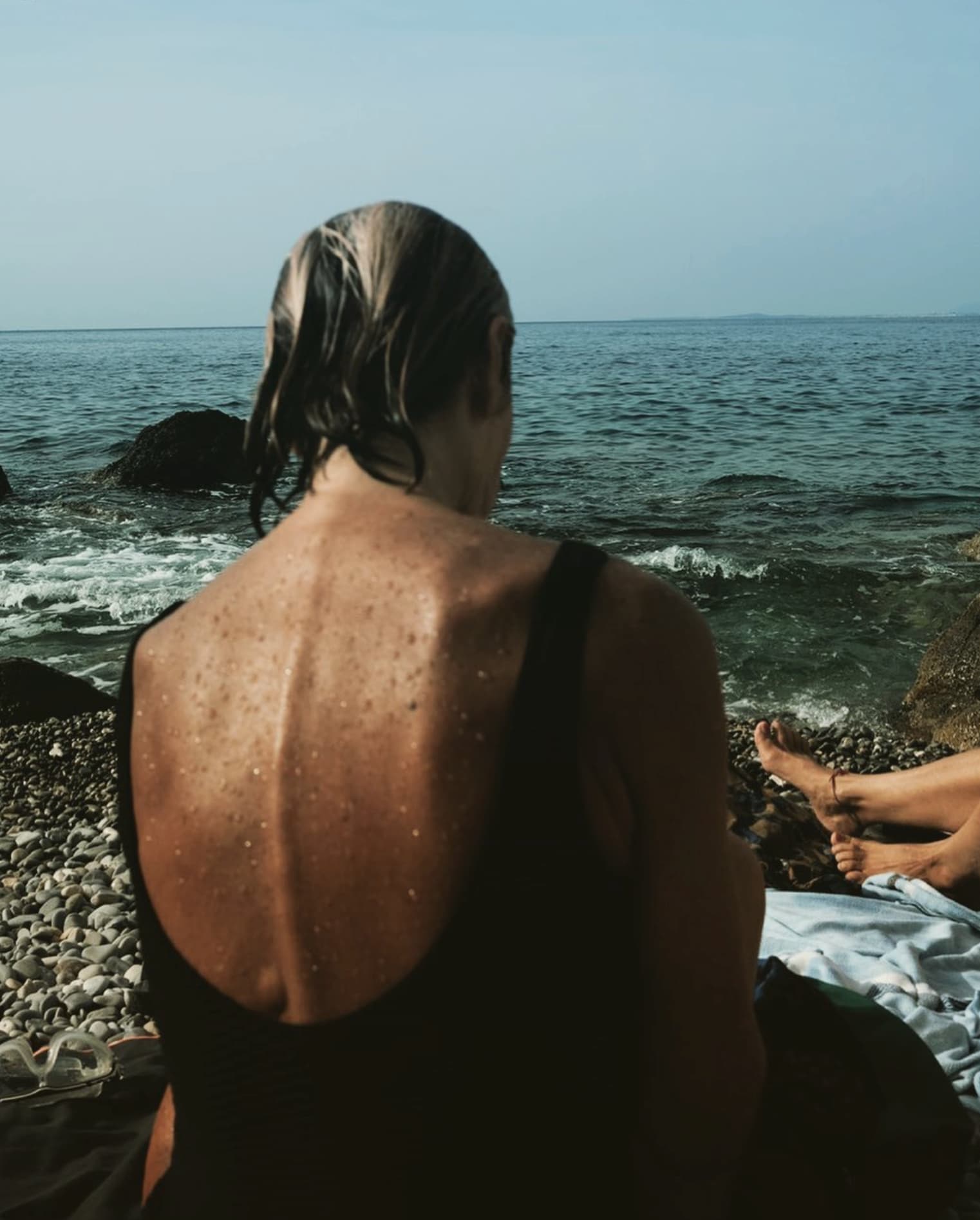 Yvan Canal Street 55 — woman seen from behind facing the sea, Nice